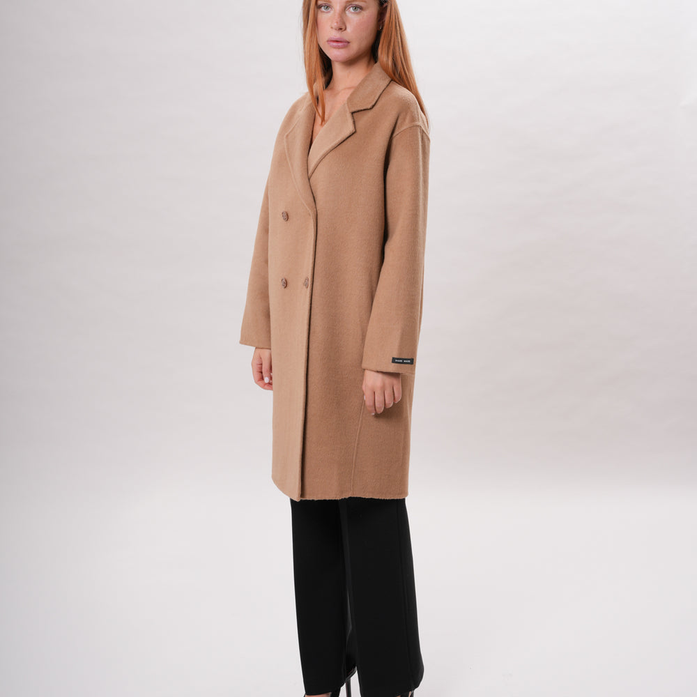 
                      
                        PETER HADLEY WOMAN - Cappotto in lana handmade
                      
                    