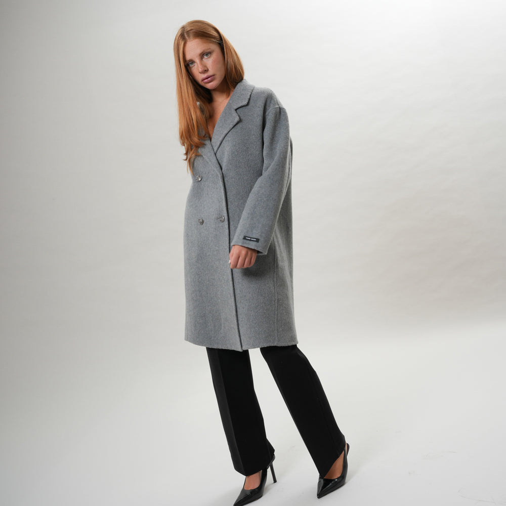 
                      
                        PETER HADLEY WOMAN - Cappotto in lana handmade
                      
                    